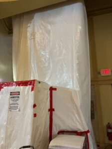 Negative pressure containment tent for removal of Asbestos in occupied buildings.