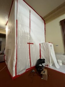 Negative pressure containment tent for removal of Asbestos in occupied buildings.