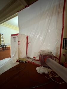 Negative pressure containment tent for removal of Asbestos in occupied buildings.